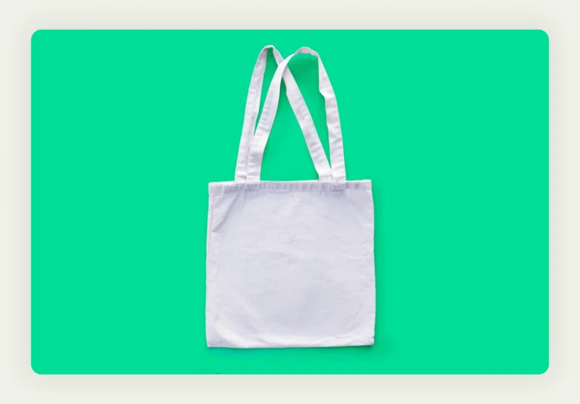 Professional branded tote bags with company logo displayed at trade show booth